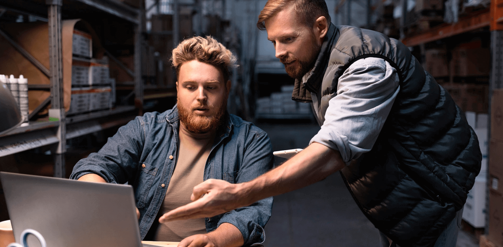 Image of two men discussing work